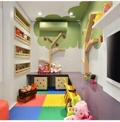 a child's playroom with colorful flooring and toys