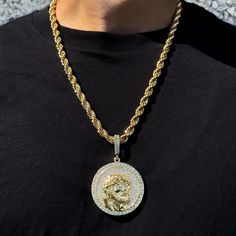 This elegant Iced Large Jesus Medallion pendant is a timeless and versatile accessory that can be worn for any occasion. It is made of gold/silver-plated alloy and comes with a 8mm Rope chain. The pendant is 2" wide and 2" long. The available length is 24 inches. Features: - Material: Gold/Silver plated alloy - Dimensions: 2 inch wide and 2 inch long - Includes: 8mm Rope chain - Available length: 24 inches - A thoughtful gift for a loved one We are so confident that you will love our Large Jesus Medallion pendant that we offer a 100% satisfaction guarantee. If you are not happy with your purchase for any reason, simply return it for a full refund. Order your Large Jesus Medallion pendant today and start adding a touch of style to your look! Metal Jewelry With Round Rope Chain, Metal Jewelry With Rope Chain And Round Shape, Round Metal Jewelry With Rope Chain, Gold Rope Chain Necklace With Round Pendant, Expensive Jewelry Luxury, Cute Black Guys, Jewelry Essentials, Expensive Jewelry, Rope Chain