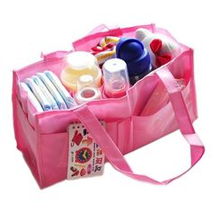 a pink tote bag filled with baby items