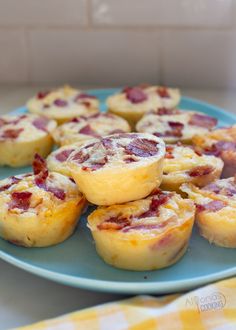 small muffins on a blue plate with yellow and white checkered table cloth