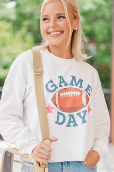 shop the mint, trendy online boutique, boutique clothing Game Day White Relaxed Fit Sweatshirt, White Relaxed Fit Sweatshirt For Game Day, Collegiate Sweatshirt For Game Day, White Casual Sweatshirt For Game Day, Casual White Sweatshirt For Game Day, Casual Tops For Cheerleading In Fall, Sporty Tops With Ribbed Cuffs For Game Day, Collegiate Sweatshirt For Game Day In Fall, School Spirit Sweatshirt For Game Day