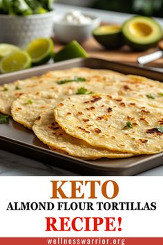 keto flour tortillas on a baking sheet with limes and avocado in the background