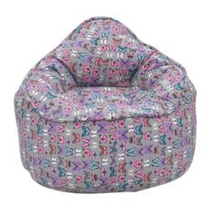 a grey bean bag chair with pink and blue butterflies on the top, sitting in front of a white background