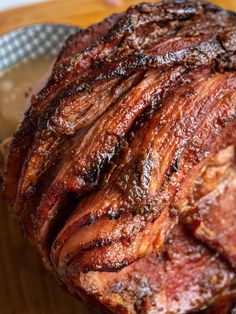 a large piece of meat sitting on top of a wooden cutting board