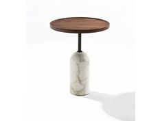 a marble and wood side table with a round wooden tray on the top that has a black metal base