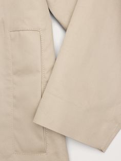 Often called a "Mac Coat", this relaxed iteration of a tailored rain coat is cut from a bonded cotton fabric finished with a water-resistant coating and fully sealed seams to keep the elements at bay.  Water-Repellant Relaxed fit.  Warmer: Unlined.  Point collar with snap front closure.  Two front pockets.  Center-back box pleat detail.  Unlined.  Relaxed fit with A-line skirt.  Long sleeves.  Midi length.  Model: Size S, 5'10" (178cm). Mac Coat, Skirt Long, Rain Coat, Box Pleats, A Line Skirts, Banana Republic, Cotton Fabric, Water Resistant, Mac