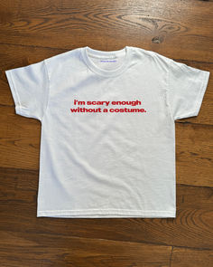 'I'm Scary Enough Without A Costume' Baby Tee & T-shirt
Halloween Outfit
Our tees are mid-weight 100% cotton with a classic 90's baby tee fit.
Shipping: Currently we ship worldwide from the following distribution hubs: UK, USA, Germany, Canada, Poland and Australia. Halloween Outfit, Baby Costumes, Women's Wardrobe, Quote Aesthetic, Apparel Design