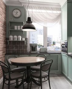 a kitchen table with four chairs and a clock on the wall above it in front of a window