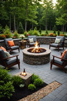 an outdoor fire pit surrounded by chairs and plants in the middle of a patio area