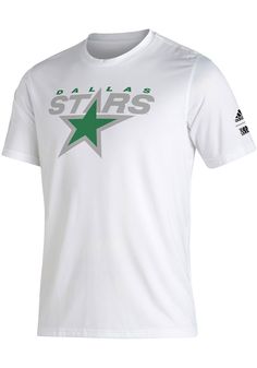 a white shirt with green stars on it