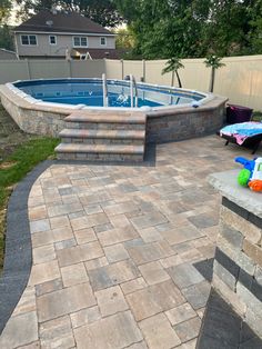 an above ground swimming pool with steps leading to it