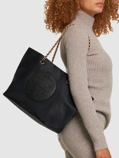 Find TORY BURCH Ella Chain Nylon Tote Bag on Editorialist. Height: 29cm Width: 32cm Depth: 16cm. Handle drop: 23cm. Double top handles. Front logo detail. One front snap button pocket Evening Bags With Logo Charm, Elegant Black Bag With Logo Charm, Chic Bags With Logo Charm For Everyday, Chic Travel Bag With Logo Charm, Ysl Lip, Cult Gaia Bag, Maje Dress, Tods Bag, Tory Burch Ella