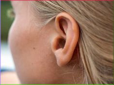 a close up of a child's ear with the text, what do you think?