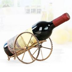 a bottle of wine sitting on top of a wooden cart