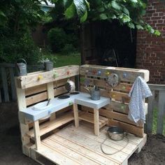 an outdoor kitchen made out of wooden pallets