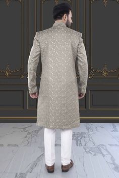 This men's Sherwani, style M42-S135, features exquisite thread embroidery and delicate sequin details. Impeccably crafted, this traditional garment offers a touch of luxury and sophistication to any occasion. Elevate your style with this stunning piece, perfect for weddings or special events. Eid Traditional Sherwani With Chikankari Embroidery, Long Sleeve Kurta With Naqshi For Reception, Formal Chikankari Embroidery Straight Kurta Bandhgala, Festive Long Sleeve Traditional Fit Sherwani, Festive Long Sleeve Sherwani For Reception, Traditional Fit Sherwani With Zari Work For Eid, Long Sleeve Kurta With Dabka For Reception, Eid Sherwani With Zari Work And Traditional Fit, Eid Sherwani With Zari Work In Traditional Fit