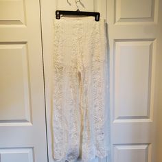 Never Worn. Lined With Shorts. Side Zipper And Hook Closure. Small Stain On Rear Covered By Lace (See Pic). Beautiful Flowy Bohemian Pants. 41.5 Inches Long. Legs Are 13 Inches Wide. Waist Is 27 Inch Circumference. White Stretch Bohemian Pants, White Bohemian Stretch Pants, White Lace Bottoms With Elastic Waistband, Summer Bottoms With Lace Trim And Non-stretch Fit, Bohemian Lace Trim Pants For Spring, Full Length Bottoms With Lace Trim For Spring, Elegant Lace Bottoms For Vacation, Fitted Vacation Bottoms With Lace Trim, Fitted Bottoms With Lace Trim For Vacation