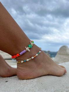 Add a touch of unique style to your summer wardrobe with these stunning handmade ankle bracelets! Casual Colorful Beaded Anklets For Summer, Multicolor Tiny Beads Bracelets For Beach Season, Multicolor Tiny Beads Bracelet For Beach Season, Colorful Tiny Beads Bracelets For Beach, Colorful Tiny Beaded Bracelets For Beach, Colorful Tiny Beaded Bracelets For The Beach, Colorful Beaded Bracelets For Summer Vacation, Colorful Beaded Bracelets For Summer Beach Party, Multicolor Beaded Strand Bracelets For Beach Party