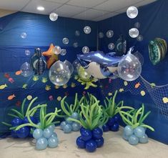 an ocean scene with balloons and fish in the water