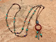 This listing is for one hand crafted necklace in a Bohemian Style featuring a Carnelian ring tassel pendant with bronze wire wrapped semi-precious stone links including Carnelian, Turquoise, Aquamarine, Amethyst, Peridot, Garnet, Labradorite, Jade, leather, African metal and sterling silver.  Adjustable 30"-32.  Tassel measured from top of silver bead is about 2 1/2". Bohemian Brown Long Necklace For Gift, Bohemian Brown Long Necklace As Gift, Brown Bohemian Long Necklace For Gift, Bohemian Brown Long Necklace Gift, Bohemian Beaded Necklaces With Round Pendant, Bohemian Beaded Necklace With Round Pendant, Handmade Bohemian Pendant Lariat Necklace, Bohemian Long Dangle Necklace With Adjustable Chain, Bohemian Adjustable Soldered Necklaces