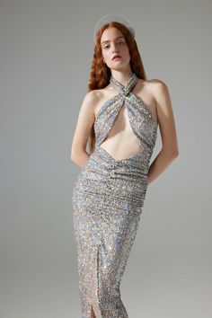 You will be feeling like "VESPER" wearing RHEA. STYLE CODE: VVSS24-DR1226DESCRIPTION: Crossover halterneck draped sequin dressFABRIC TYPE: SequinMAIN FABRIC: 100% PolyesterCOLOR: 903 Silver MultiSIZE:Model is 176cm and is wearing size 36. Bust: 86 cm Waist: 62 cm Hips: 89 cmFITTING: Fits true to size, take your normal sizeSIZE AND FIT INFORMATIONS: Light-weight , stretchy fabric Cocktail Halter Neck Evening Dress For Party Season, Embellished Halter Neck Sequin Dress For Gala, Halter Neck Embellished Sequin Dress For Gala, Halter Neck Sequin Dress For Gala, Glamorous Halter Dress For Cocktail And Prom, Glamorous Sequined Halter Neck Dress, Glamorous Halter Neck Contrast Sequin Dress, Evening Dresses With Draped Sequins, Draped Sequin Dress For Evening