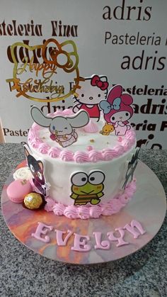 there is a hello kitty cake on the table