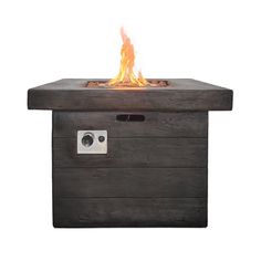 an outdoor fire pit is shown with the lid open and flames coming out from it