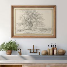 a painting hanging on the wall above a counter with bottles and vases next to it