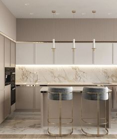 a kitchen with marble counter tops and bar stools