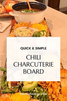 a table topped with lots of food and a sign that says quick & simple chili charcuterie board