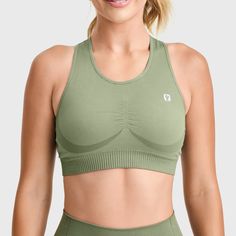 Seamless Sports Bra Our seamless sports bra is the epitome of form meeting function, crafted from stretch polyamide with 60% recycled materials for eco-conscious fashion. The design features a comfortable scoop neck that transitions to a racerback for unrestricted movement, while the seamless construction minimizes chafing and irritation. Medium support and a ribbed hemline provide stability during any workout. We've made choosing an outfit easy buy creating a matching set combo, with the seamless high waist leggings. Product Details True in size Seamless design Sports bra Scoop neck Racer back Medium support Ribbed hemline Color Military Green Material 94%Polyamide 6%Elastane Product Code F3WSFB10-V52 Seamless High Stretch Scoop Neck Sports Bra, High Stretch Seamless Sports Bra With Scoop Neck, Seamless High Stretch Sports Bra With Scoop Neck, High-stretch Seamless Sports Bra With Scoop Neck, Seamless Medium Support Sports Bra With Scoop Neck, Seamless Compressive Sports Bra With Scoop Neck, Seamless Compressive Sports Bra, Seamless Scoop Neck Sports Bra In Nylon, Seamless Scoop Neck Nylon Sports Bra