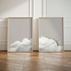 two empty frames with clouds in them on the floor