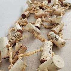 several wine corks are laid out on the floor to be used as decorations or wall hangings