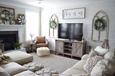 a living room filled with furniture and a flat screen tv on top of a fireplace