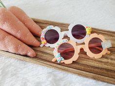 Adorable customized sunglasses for your little ones! These sunglasses are perfect for boys or girls. One size only - and should fit your little ones ages (2-9). Each pair of glasses is made with coordinating flat resin charms chosen at random. You will get two or three charms that coordinate with your colors and other charms. SHOP DISCLAIMER/WAIVER!  -Do NOT let your child put the sunglasses in their mouth as beads can become detached- your oversight is extremely important. Always supervise and Customized Sunglasses, Easter Gift For Kids, Diy Sunglasses, Spring Sunglasses, Personalized Sunglasses, Easter Basket Fillers, Easter Gifts For Kids, Flower Girl Gifts, Resin Charms