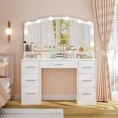 a white vanity with lights on it in a bedroom next to a bed and window