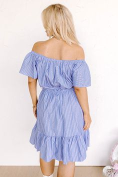 Plus Size - You are sure to look simply supreme in this stunning sky blue dress featuring lightweight breezy material patterned with white accent stripes, a straight elastic neckline with short sleeves that can be worn on or off the shoulder, a tie belt waistline, and a flattering silhouette that falls into a peplum bottom with an uneven knee-length hemline! Measurements 1XL : Bust 36", Hip 40", Length 34", Sleeve Length 7.5", Waist 28-32". 2XL : Bust 38", Hip 42", Length 34.5", Sleeve Length 8" Sky Blue Dress, Faux Suede Boots, Swimsuit Sale, Stripe Dress, White Accents, Model Fits, Tie Belt, Hip Length, Blue Dress