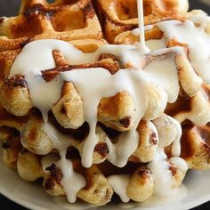 a waffle covered in white icing sitting on top of a plate