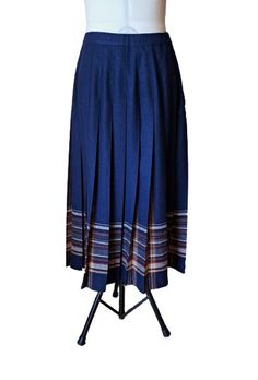 Vintage 70s Pendleton wool pleated skirt in navy blue, brown, beige, rusty, mustard. Zipper up the side and button waist. It is not lined. Composition - 100% virgin wool, made in USA. Marked size UK10 fits like a 12US. Excellent vintage condition. Flat measurements: waist - 36 cm/ 14.1'' /there is lightly stretch/ length - 81 cm/31.9'' Vintage High Waist Denim Blue Skirt, Blue Vintage Skirt With Pockets, Retro Blue Lined Skirt, Vintage Blue Pleated Skirt Bottoms, Vintage Blue Lined Skirt, Pendleton Wool, Cheongsam Dress, Pleated Midi Skirt, Cheongsam