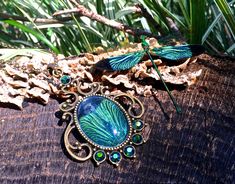 "This amazing real dragonfly necklace is handcrafted from a set of REAL Indonesian Green Damselfly wings (Scientific name: Neurobasis Chinensis)! (read below for more on how I ethically obtain the wings!). The butterfly wing is set in your choice of an antique gold (as pictured), silver, or gunmetal vintage style setting with iridescent green Swarovski crystals. Your choice of chain length (18\" short or 30\" long) with upgrades to Sterling silver available with the silver pendant option. The pe Adjustable Wing-shaped Jewelry For Gifts, Adjustable Wing-shaped Jewelry Gift, Elegant Adjustable Wing-shaped Jewelry, Elegant Dragonfly Jewelry For Jewelry Making, Elegant Adjustable Dragonfly Jewelry, Handmade Gold Dragonfly Jewelry, Elegant Green Dragonfly Shaped Jewelry, Green Dragonfly Jewelry For Gifts, Green Dragonfly Jewelry As A Gift