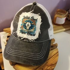 This cheetah print / leopard print baseball cap is super stylish and includes a raggedy patch with peace love sunshine. A great hat for all your summer jaunts. Limited availability of this cap style & color! This trucker hat with a ragged southwestern cow skull design "Wild Soul Pure Heart" is perfect for the woman who loves to wear caps and loves her some country. Cap front color is a washed dark gray. Super cute just for you! Limited availability of this cap style & color! Painted Hats, Cow Skull, Skull Design, Ball Cap, Cheetah Print, Dark Gray, Fashion Backpack, Peace And Love, Leopard Print