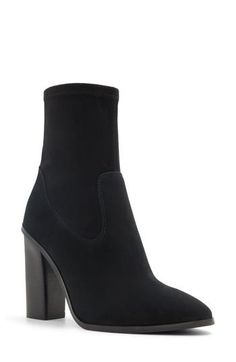 A stretchy shaft adds modern appeal and comfortable wear to a cushioned bootie framed by an almond toe and stacked block heel. 5 1/2" shaft 4" heel Side zip closure Cushioned footbed Leather and textile upper/recycled polyester, textile and synthetic lining/synthetic sole Imported Heeled Boots With 4-inch Block Heel In Medium Width, Heeled Boots With 4-inch Block Heel, Trendy Medium Width Heeled Boots With 4-inch Heel, Trendy Fitted Booties With Block Heel, Boots With 4-inch Block Heel And Medium Width, Trendy Boots With 4-inch Block Heel, Fitted Platform Boots With Block Heel, Fitted Platform Boots With Padded Block Heel, Wide Calf Stacked Heel Boots For Night Out