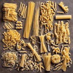 many different types of pasta are laid out on the table together and ready to be eaten