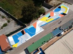 an aerial view of a colorfully painted airplane