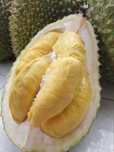 the fruit is cut in half and ready to be eaten