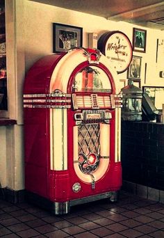 an old fashioned red and white juke box