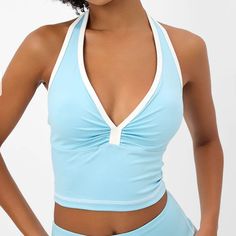 Frankies Bikinis “Lively” Cropped Halter In “Baby Blue” Color Way We All Love A Good Workout Fit And Lively Is Here To Deliver. This Halter Sports Bra Is Designed With Extra Support For Bigger Busts, A Dainty White Trim, And Our Beautiful Baby Blue. Paired Back With The Lively Legging, This Halter Sports Bra Is Stylish And More Sustainable Than Ever Before! Nwt Triangle Top With Built-in Bra For Pool, Playful Fitted Tankini For Poolside, Blue T-back Halter Top For Poolside, Playful Fitted Sports Top, Blue T-back Summer Swimwear, Halter Neck Tops For Beach Season Poolside, Summer Blue Racerback Tankini, Blue Racerback Tankini For Summer, Halter Neck Top For Beach Season Poolside