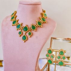 Revel your twirly moments adorning our glamorous Amyra Set! Cast a spell in this elegant set featuring a beautiful layout of ruby/emerald and CZ stones. The set includes a pair of matching earrings. Approximate earrings length is 2.25". Gold-plated on high-quality brass as base metal. Amyra Set (Ruby) is in-stock & ready-to-ship. Delivery time frame for Amyra Set (Emerald) is 5-7 weeks. For custom or urgent requests, please contact support@alacouture.com. *Please Note: We use faux stones and bea Cast A Spell, Ruby Emerald, Elegant Sets, Faux Stone, Cz Stone, Base Metal, Matching Earrings, Ruby, Emerald