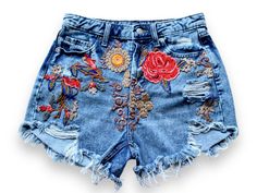 "Pre Loved  Denim cutoff shorts featuring embroidered flower appliqué,  high waist   silhouette with raw hem. Handmade embroidery  This is a unique item made with love in a friendly workspace ! All our products are handmade and constructed from pre existent materials that were either discarded or coming from vintage stores !!  All our clothing are made with recycled materials.   We all know how harmful clothing waste can be to our beloved planet, so help us spread upcycle love and buy clothing that is part of a solution rather than the cause of a problem. Welcome to our community !  Details :  Medium  W28/29/ US 6 *Rise: 12\" *Inseam: 3.5 Pre - loved item ❤️" Trendy Jean Shorts For Spring Festival, Casual Embroidered Jean Shorts For Summer, High Waist Floral Embroidered Jeans For Summer, Bohemian Cotton Jean Shorts For Spring, Embroidered Cutoff Shorts For Summer, Summer Cutoff Jeans With Floral Embroidery, Casual Embroidered Cutoff Shorts, Bohemian Denim Jean Shorts For Summer, Summer Floral Embroidery Cutoff Jeans