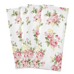 three napkins with pink roses on them